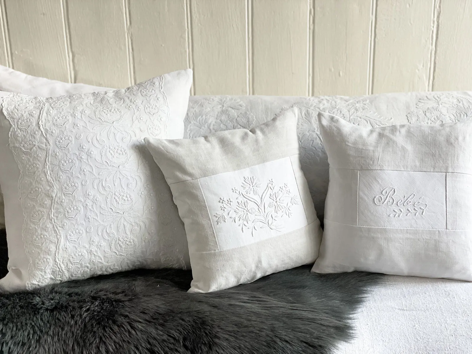 Bébé - An Antique French White on White 'Bébé' Embroidered 30cm Cushion